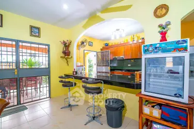 Charming kitchen with open layout and breakfast bar in vibrant home