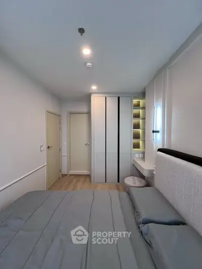 Modern bedroom with sleek design and built-in storage solutions