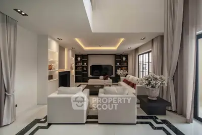 Luxurious modern living room with elegant decor and spacious seating area.