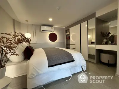 Modern bedroom with stylish decor and ample storage space