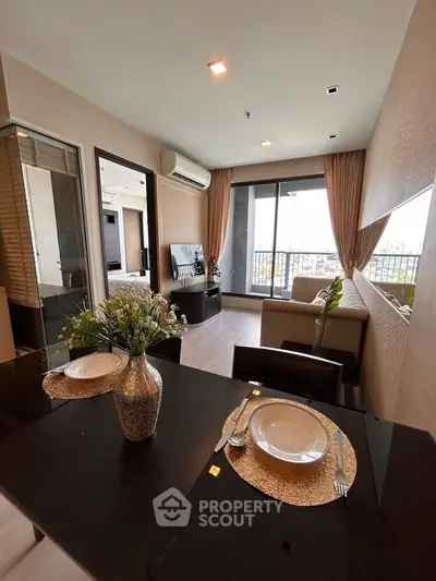 Modern living room with balcony view and elegant dining setup