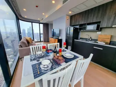 Luxurious high-rise condo with stunning city view and modern open kitchen layout.