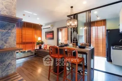 Modern open-layout kitchen and dining area with stylish decor and natural light.
