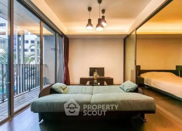 Modern living room with balcony and stylish lighting