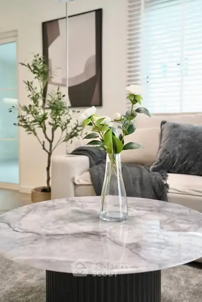 Elegant living room with marble coffee table and modern decor