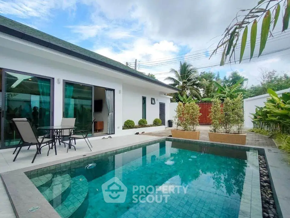 Stunning modern villa with private pool and lush garden, perfect for luxury living.