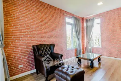 Stylish living room with brick accent wall and leather furniture