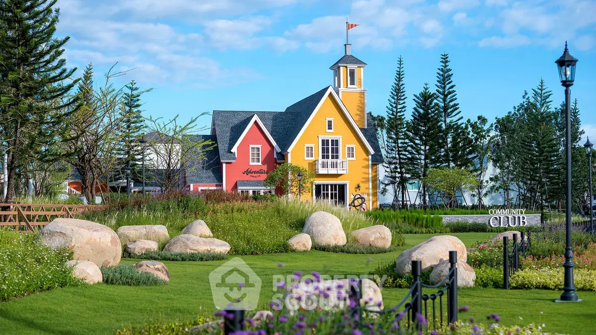 Charming colorful house with lush garden and scenic landscape