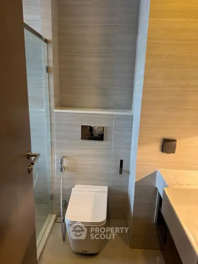 Modern bathroom with sleek design and glass shower enclosure