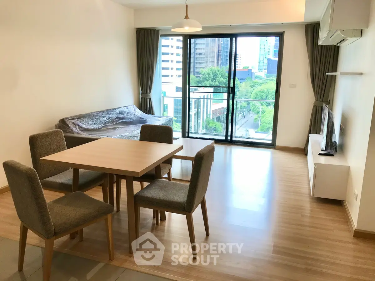 Modern living room with balcony view in urban apartment