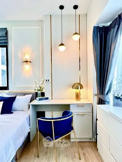 Chic modern bedroom with elegant desk, stylish lighting, and cozy decor