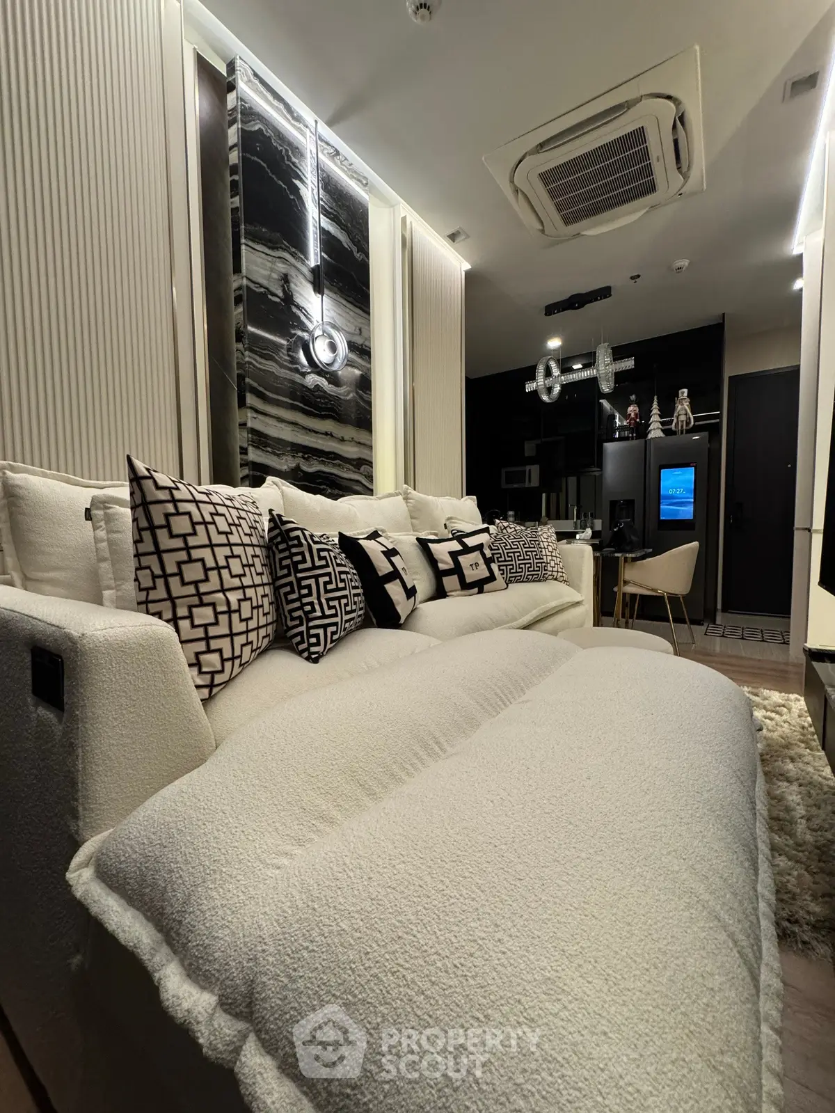 Luxurious modern living room with plush white sofa and stylish decor