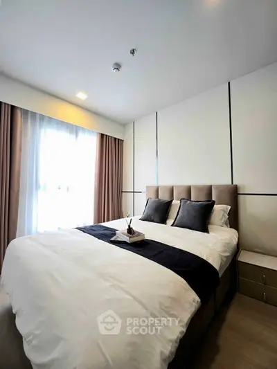 Modern bedroom with elegant decor and natural light