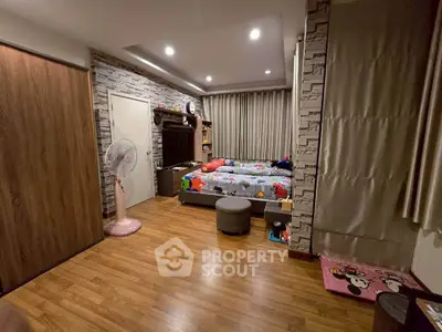 Charming children's bedroom with playful decor and cozy ambiance, perfect for a family home.