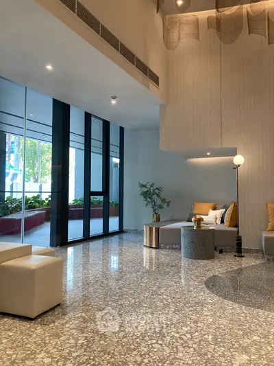 Luxurious modern lobby with elegant seating and large glass windows