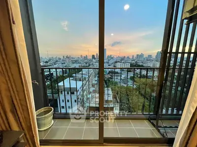 Stunning cityscape view from a high-rise balcony at sunset, perfect for urban living.