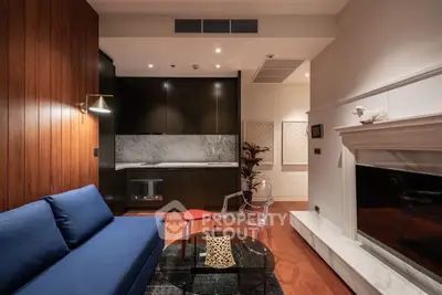 Stylish living room with modern kitchen and cozy fireplace