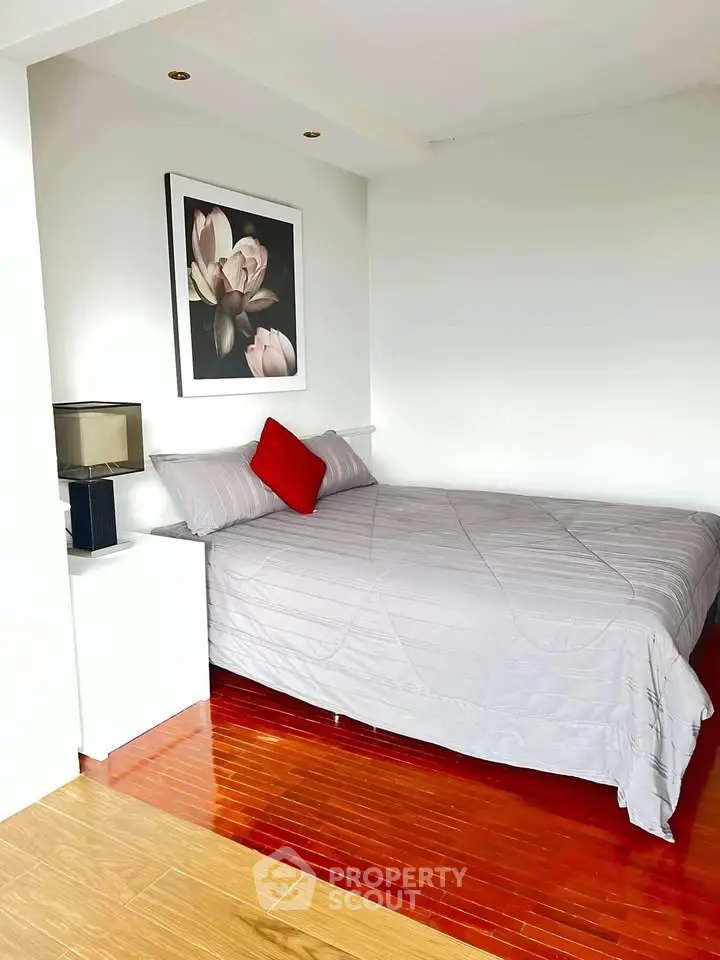 Cozy bedroom with modern decor and wooden flooring