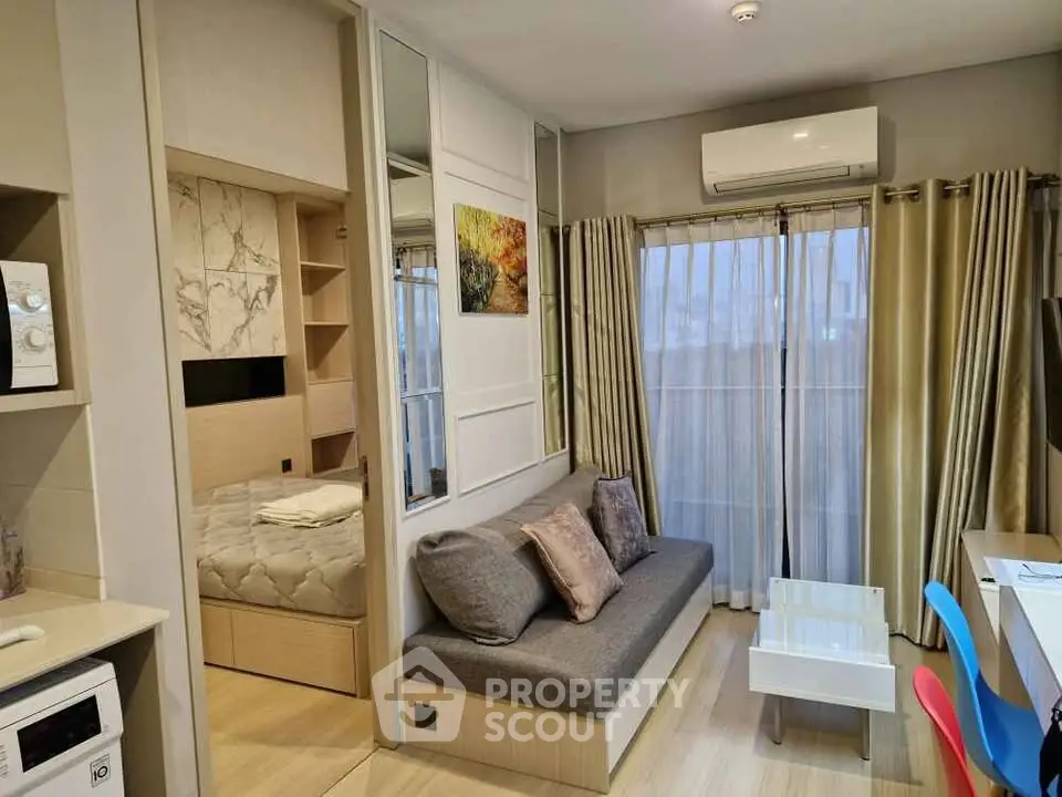 Modern studio apartment with cozy living area and stylish decor