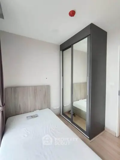 Modern bedroom with sleek wardrobe and minimalist design