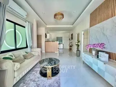 Luxurious modern living room with elegant decor and open kitchen layout