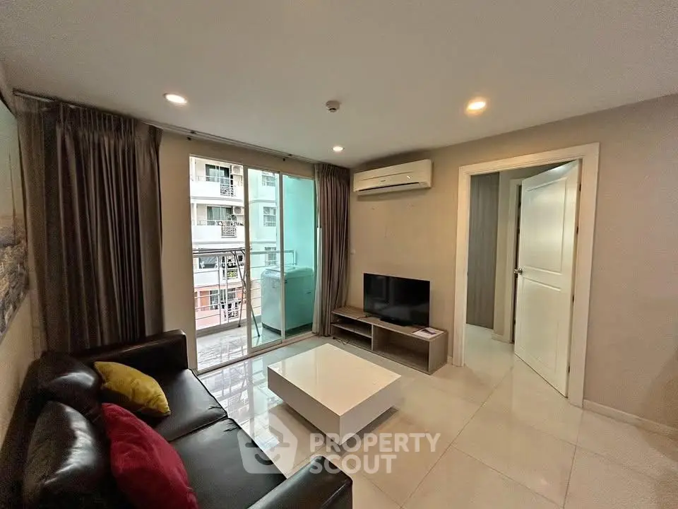 Modern living room with balcony view in urban apartment