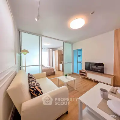 Modern open-plan living room with cozy seating and stylish decor