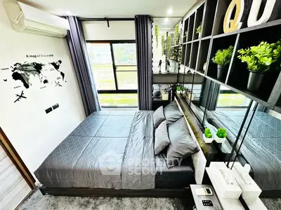 Modern bedroom with stylish decor and large window view