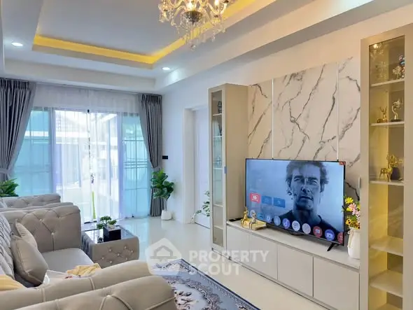 Luxurious living room with elegant decor and modern entertainment setup