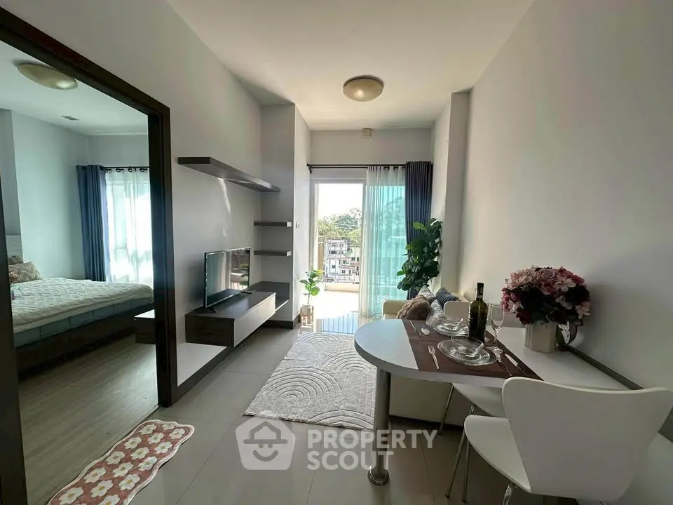 Modern apartment with open living area and balcony view