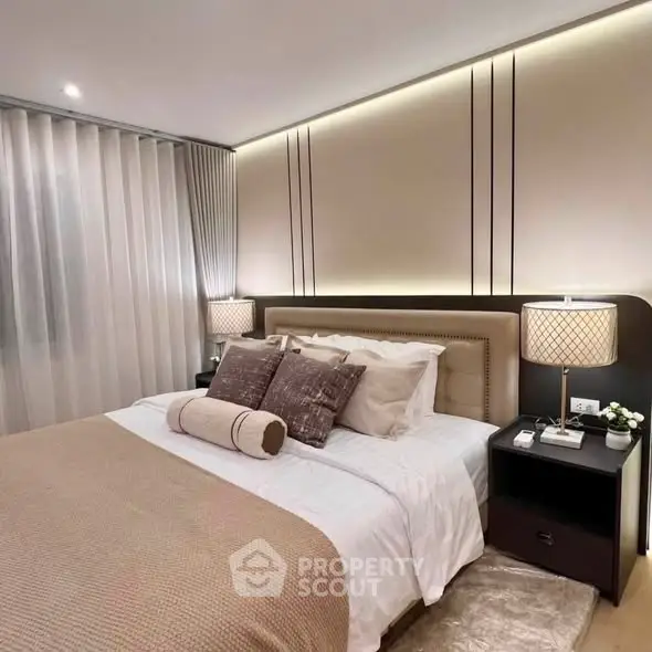 Luxurious modern bedroom with elegant lighting and plush bedding