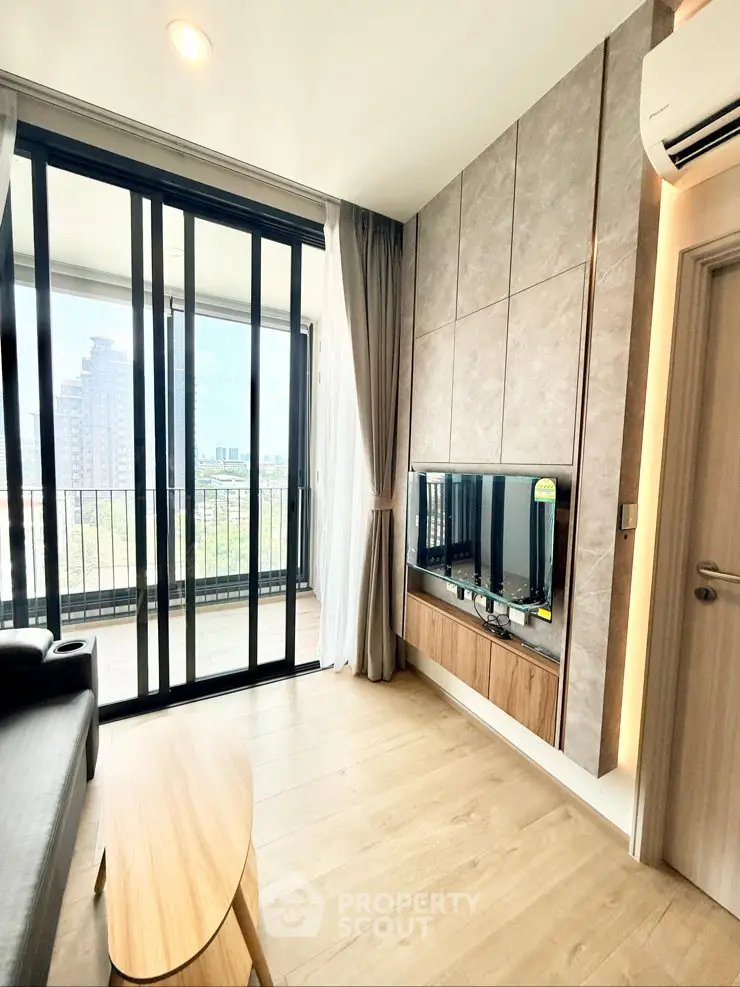 Modern living room with balcony view in high-rise apartment