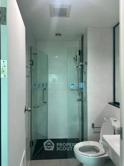 Modern bathroom with glass shower and sleek design