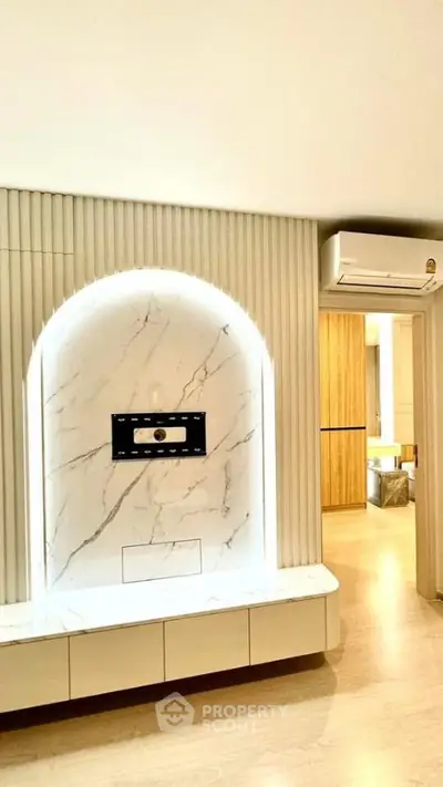 Modern living room with elegant marble feature wall and sleek air conditioning unit.