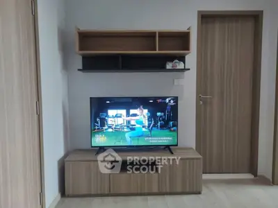 Modern living room with sleek wooden TV stand and wall shelves