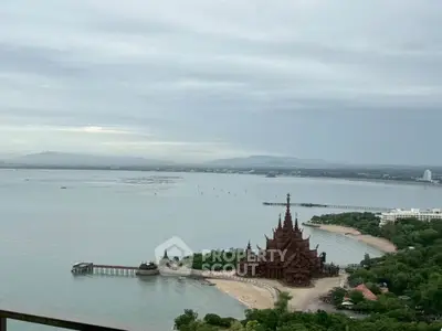 Stunning ocean view with iconic temple and lush greenery, perfect for serene living or vacation retreat.