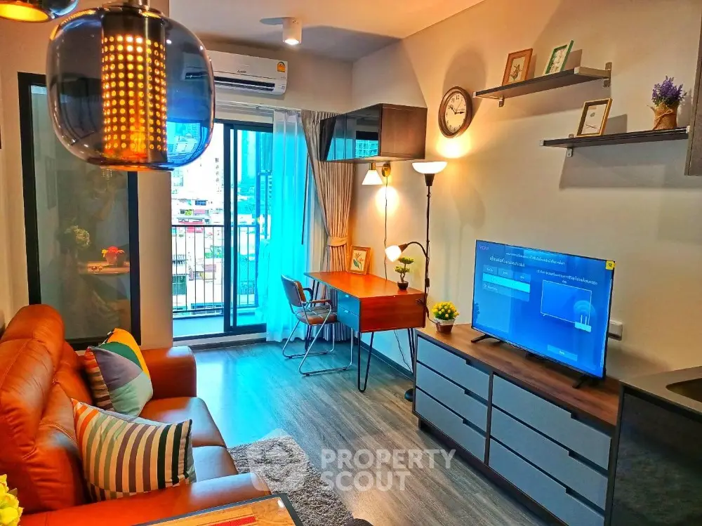 Modern living room with balcony, stylish decor, and natural light in urban apartment