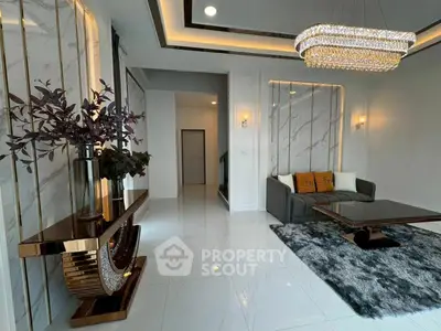Luxurious modern living room with elegant decor and chandelier lighting