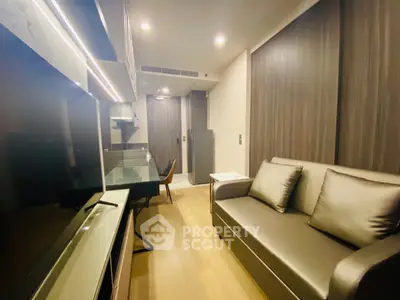 Modern living room with sleek design and comfortable seating in a stylish apartment.