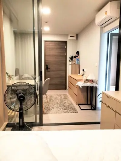 Modern apartment interior with stylish furniture and air conditioning, featuring a cozy living space and elegant decor.