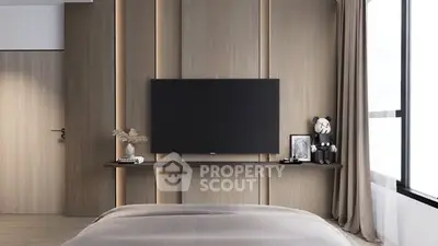 Modern bedroom with sleek TV setup and elegant decor