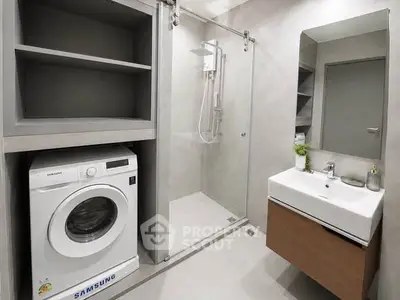 Modern bathroom with washing machine and sleek shower design