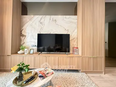 Luxurious living room with elegant wood paneling and modern TV setup