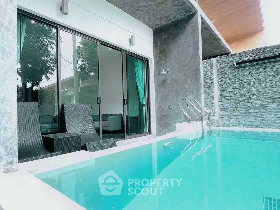 Luxurious modern villa with private pool and stylish outdoor seating area.