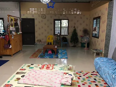 Charming living room with playful decor and cozy seating area, perfect for family gatherings.