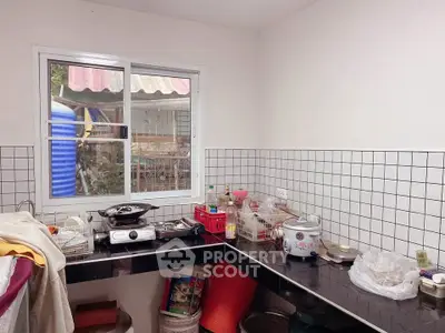 Cozy kitchen with tiled backsplash and modern appliances
