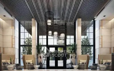 Luxurious modern building entrance with elegant seating and stylish lighting.