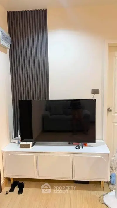 Modern living room with sleek TV setup and stylish decor