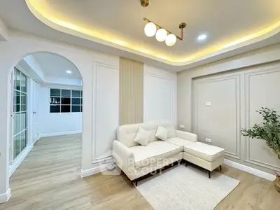 Elegant living room with modern lighting and cozy seating area