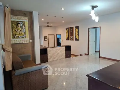 Spacious living room with elegant decor and modern lighting